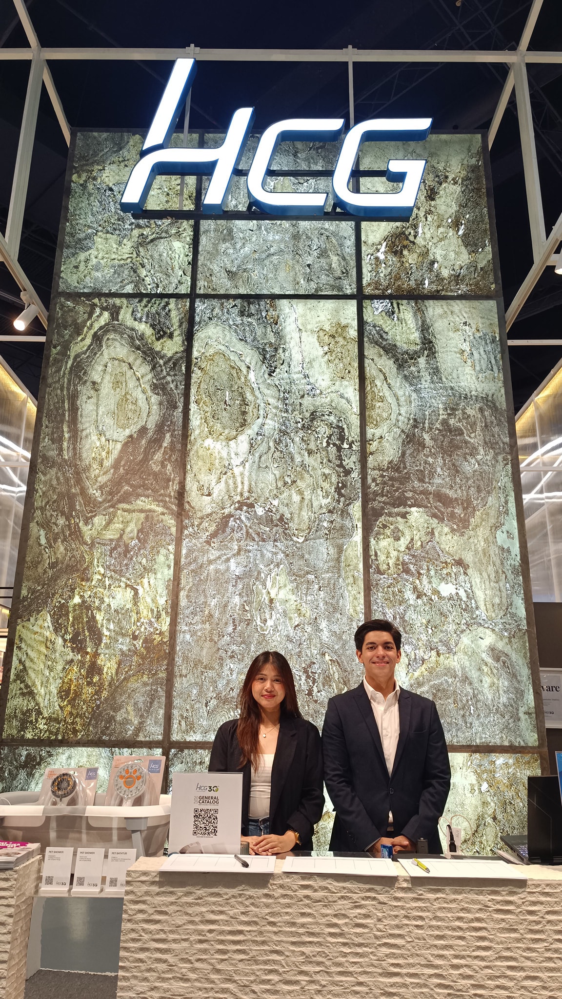 Employees posing in at one of the HCG Counters